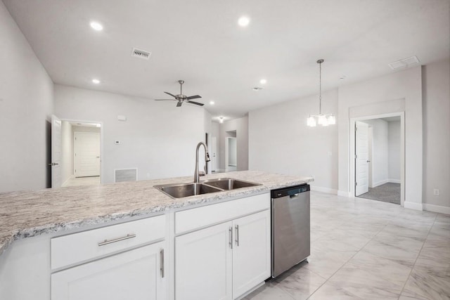 kitchen with stainless steel dishwasher, ceiling fan with notable chandelier, sink, pendant lighting, and white cabinetry