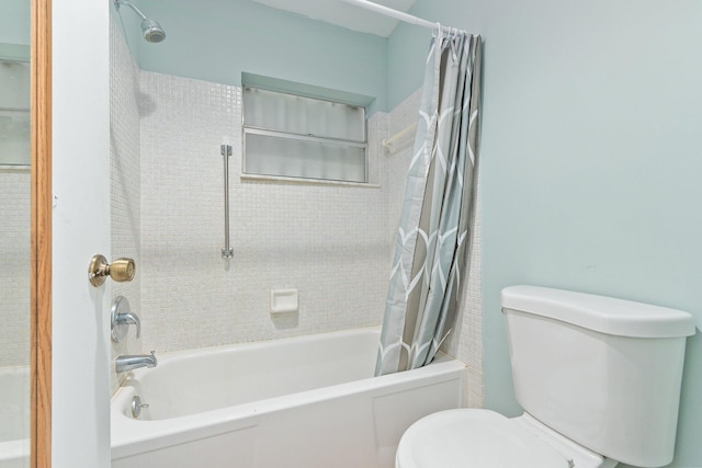 bathroom with shower / tub combo and toilet