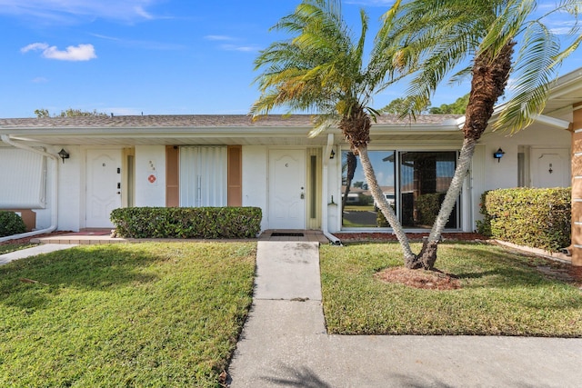 ranch-style house with a front yard