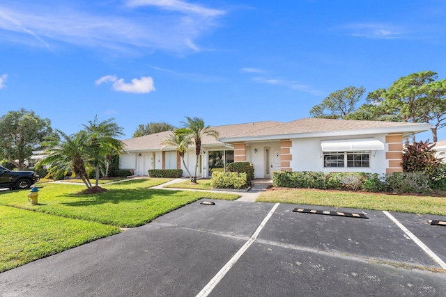 view of front of property with a front lawn