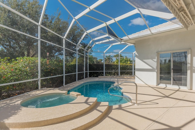 view of pool featuring glass enclosure, an in ground hot tub, and a patio