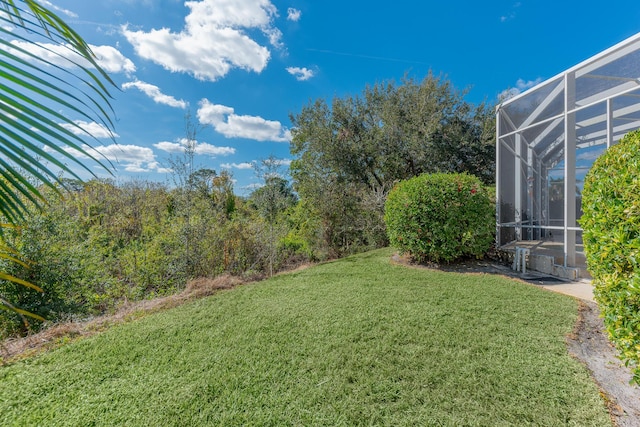 view of yard with a lanai