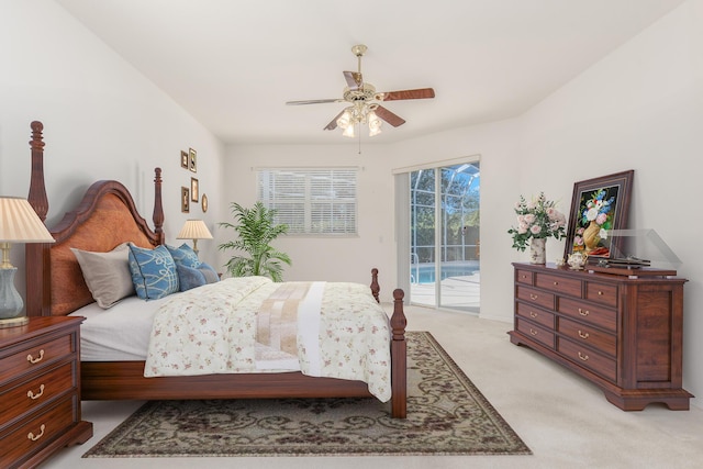 bedroom featuring access to exterior, light carpet, and ceiling fan