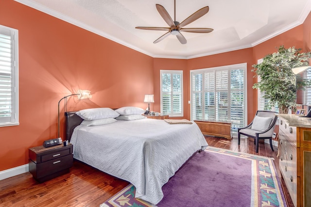 bedroom with dark hardwood / wood-style floors, multiple windows, and ceiling fan