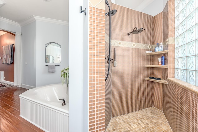 bathroom with crown molding, plus walk in shower, and hardwood / wood-style flooring