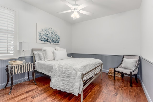 bedroom featuring hardwood / wood-style flooring and ceiling fan