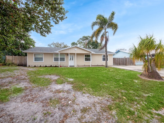 ranch-style home with a front lawn