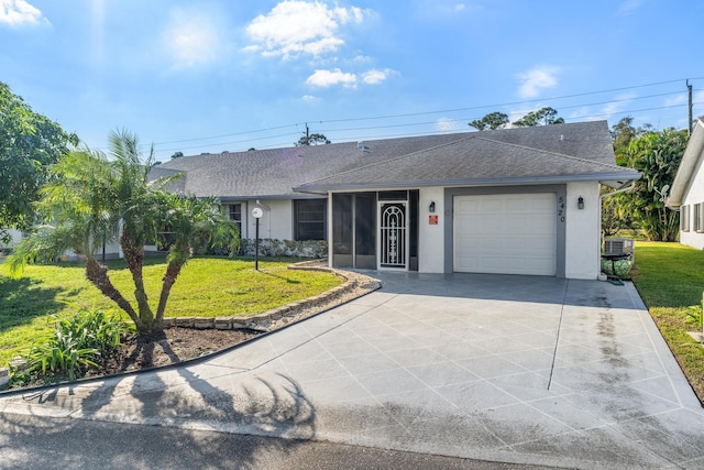 ranch-style home with a front yard and a garage