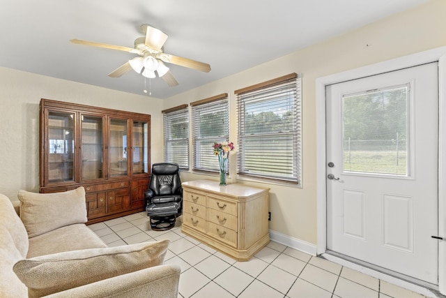 sitting room featuring ceiling fan and light tile patterned floors