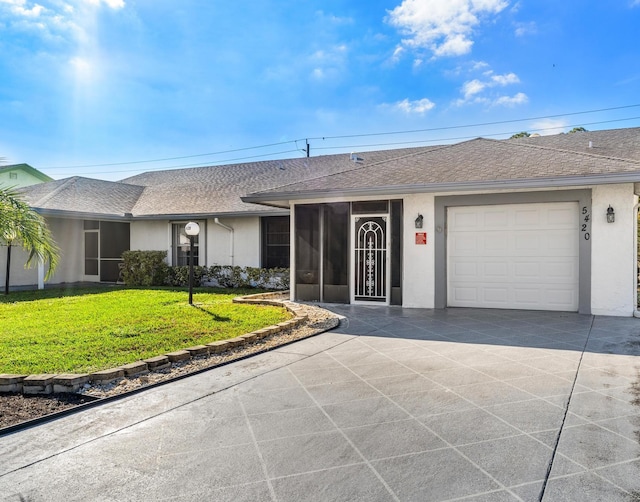 ranch-style house with a garage and a front lawn