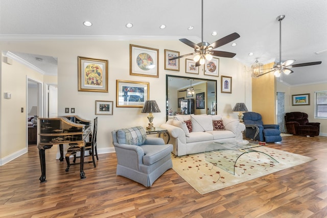 living room with ceiling fan, hardwood / wood-style floors, a textured ceiling, vaulted ceiling, and ornamental molding