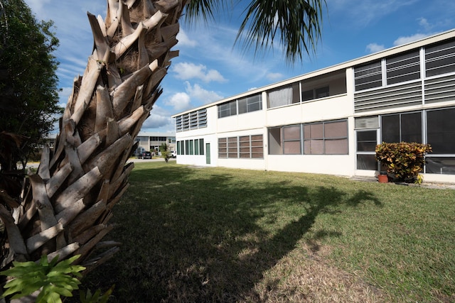 rear view of house with a yard