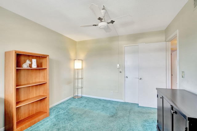 carpeted empty room with ceiling fan