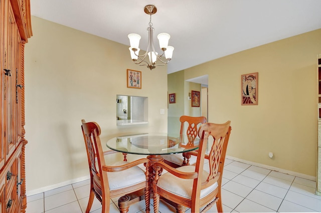 dining area featuring light tile patterned floors and a chandelier