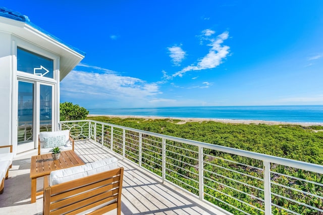 balcony featuring a water view