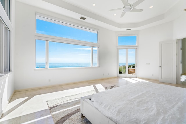 tiled bedroom with access to outside, a water view, and ceiling fan