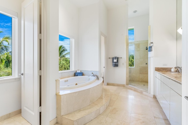 bathroom with separate shower and tub, tile patterned floors, and vanity