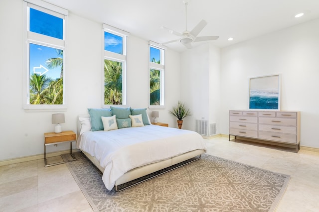 tiled bedroom with ceiling fan