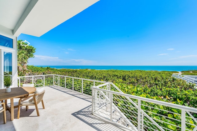 balcony featuring a water view