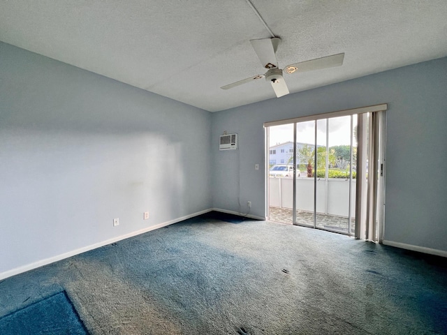 unfurnished room featuring a wall unit AC, ceiling fan, carpet floors, and a textured ceiling