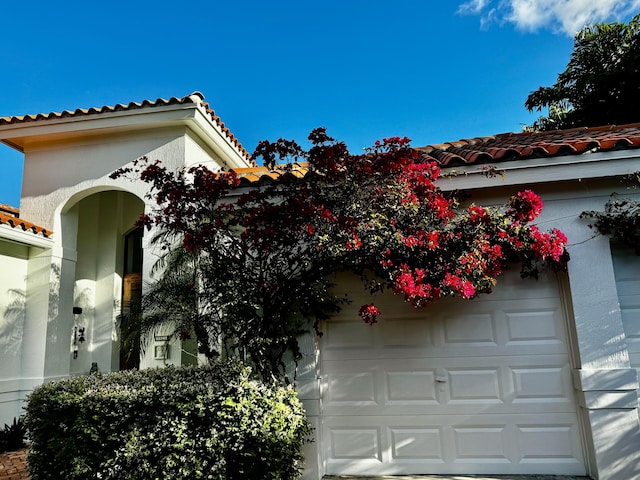 view of property exterior with a garage