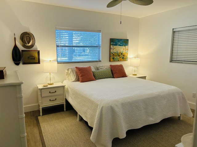 bedroom with ceiling fan and hardwood / wood-style floors