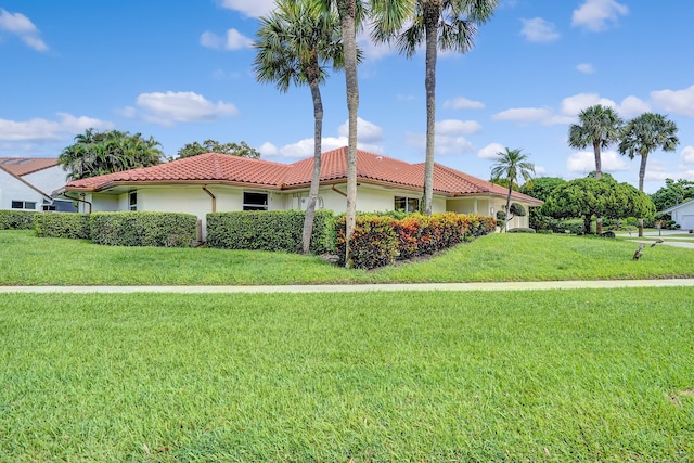 view of side of property with a lawn