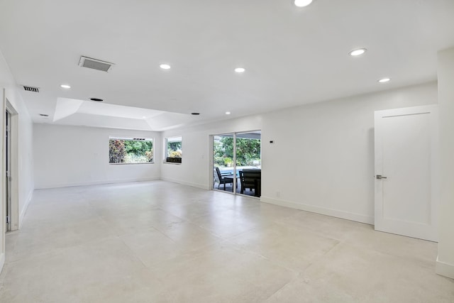 spare room featuring a raised ceiling