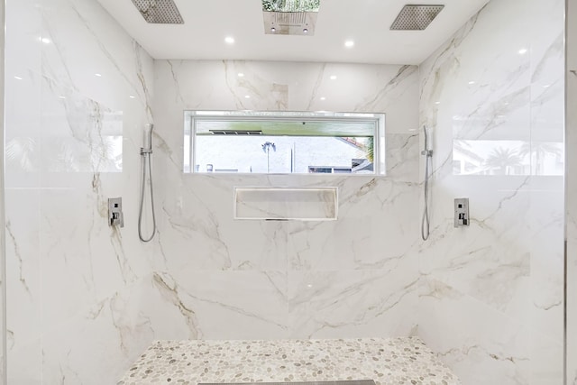 bathroom featuring tiled shower