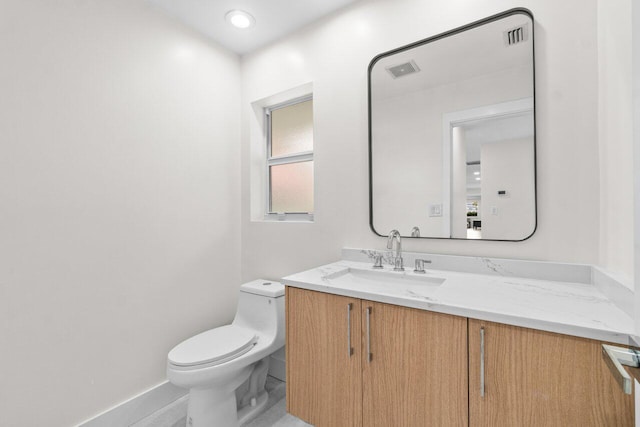 4246 Live Oak Blvd, Delray Beach, FL 33445 - bathroom with vanity, toilet, and baseboards