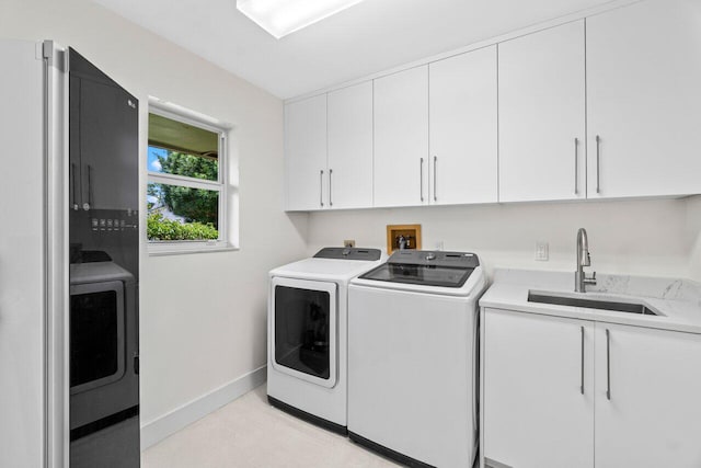 4246 Live Oak Blvd, Delray Beach, FL 33445 - laundry room featuring independent washer and dryer, cabinet space, and baseboards