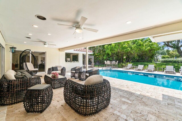 4246 Live Oak Blvd, Delray Beach, FL 33445 - view of pool with ceiling fan, a patio area, and an outdoor living space
