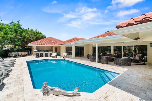 4246 Live Oak Blvd, Delray Beach, FL 33445 - outdoor pool with an outdoor hangout area, a patio area, and an outdoor kitchen
