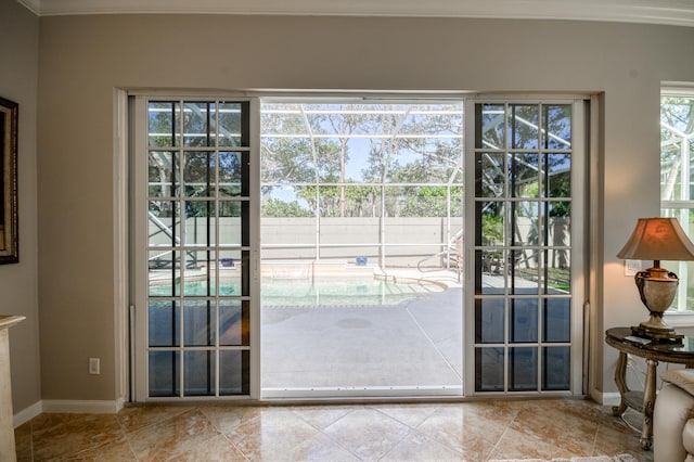 doorway featuring ornamental molding