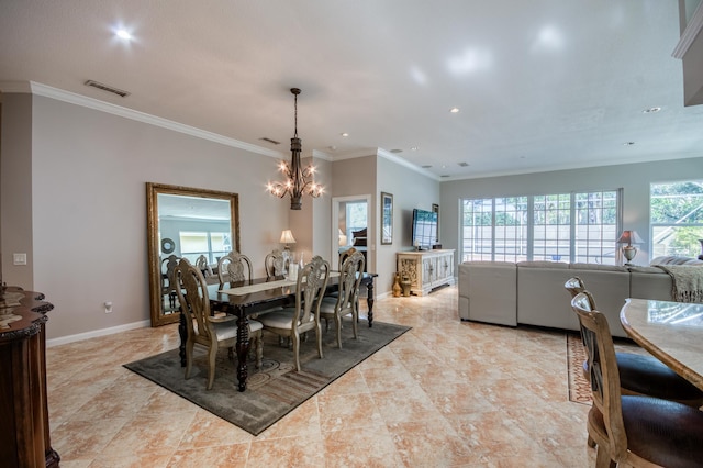 dining room featuring ornamental molding and a chandelier