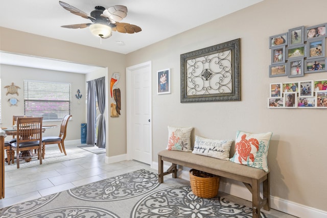 tiled entrance foyer with ceiling fan