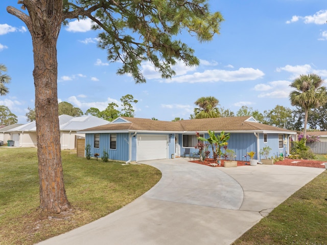 ranch-style house with a front yard and a garage