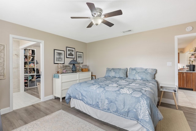 bedroom with light wood-type flooring and ceiling fan