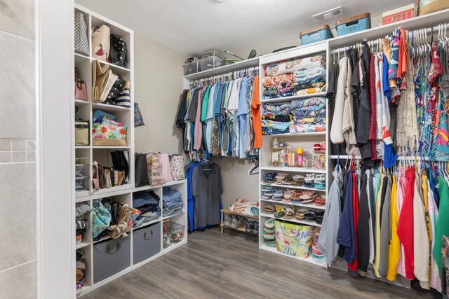 walk in closet featuring hardwood / wood-style floors