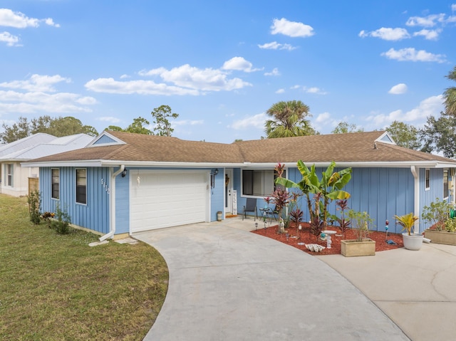 ranch-style house with a garage and a front lawn