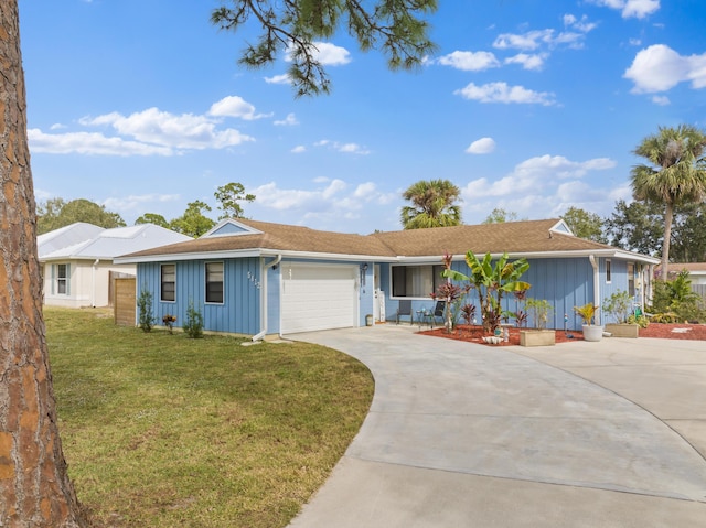 ranch-style home with a garage and a front yard