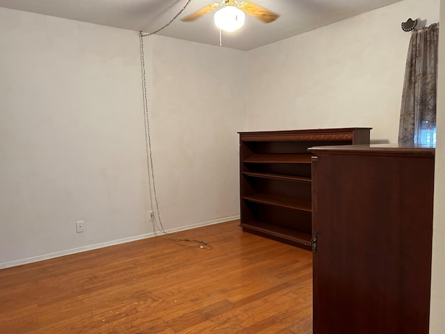 unfurnished bedroom featuring ceiling fan and wood-type flooring