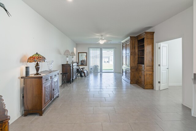 kitchen with white cabinetry, sink, light tile patterned floors, and stainless steel refrigerator with ice dispenser