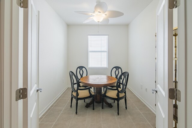 hall featuring light tile patterned floors