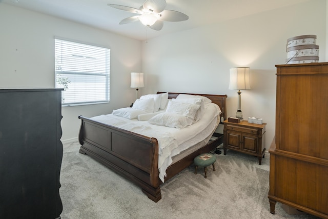 bedroom featuring ceiling fan and light colored carpet