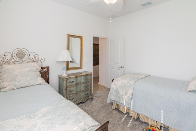 bedroom with light colored carpet and ceiling fan