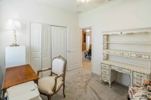 office with ceiling fan and light carpet