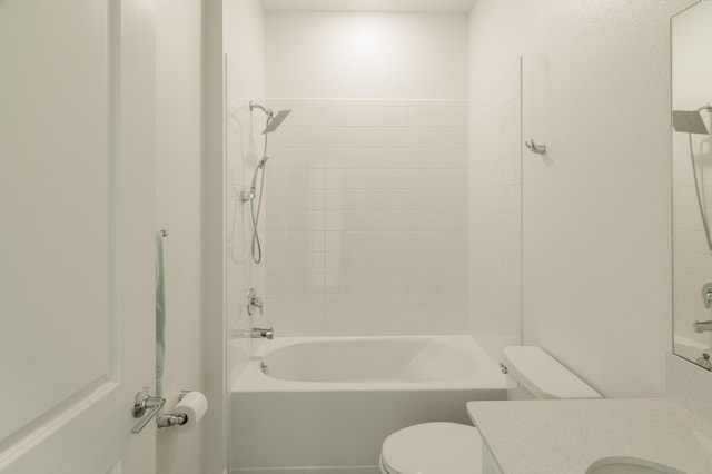 full bathroom featuring toilet, vanity, and tiled shower / bath combo