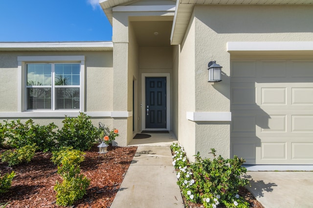 doorway to property featuring a garage