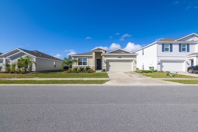 view of front of property featuring a front yard and a garage